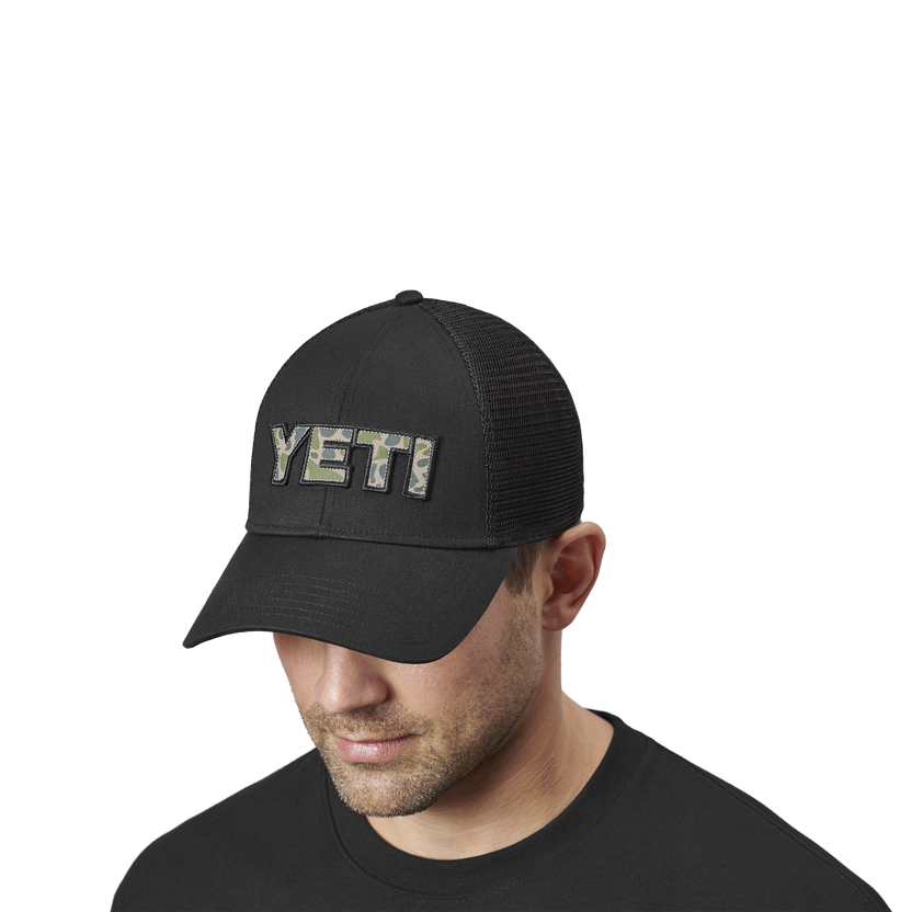 YETI CAMO LOGO BADGE TRUCKER HAT